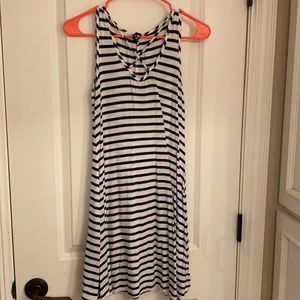 Black and white stripped casual dress with cross in front.